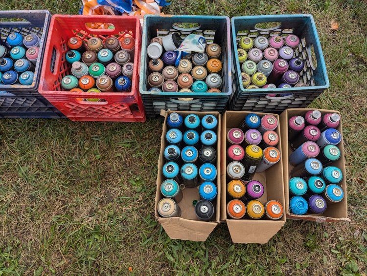 A truckload of spray paint cans and supplies was hauled to the site