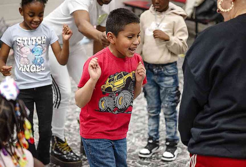 Ian Hernandez dances as he is hyped up by fellow second-graders during a class with Rooted Movement Collective on Wednesday, Jan. 29, 2025, at Harmony Leadership Academy in Texarkana, Ark. (Staff photo by Stevon Gamble)