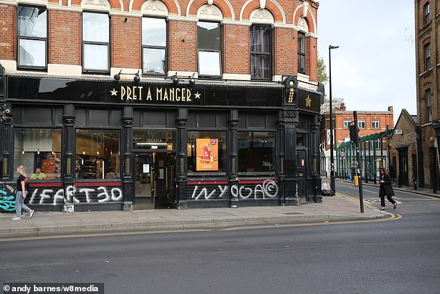 A Pret a Manger in Brick Lane covered in graffiti. Many shops - both modern and historical - have suffered a similar fate