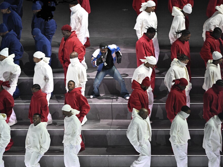 Kendrick Lamar performs alongside dancers dressed in the colors of the American flag during the Super Bowl LIX Chiefs vs Eagles Apple Music Halftime Show at Caesars Superdome in New Orleans, Louisiana.