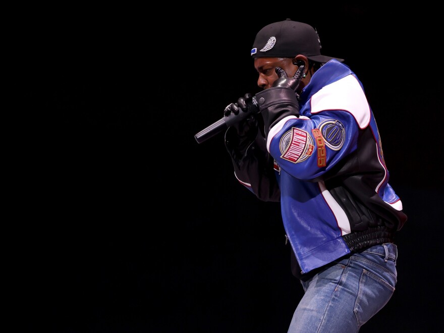 Kendrick Lamar performing onstage during the Apple Music Super Bowl LIX Halftime Show.