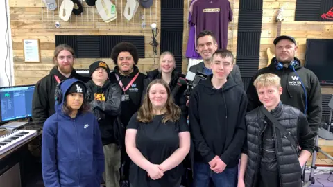 BBC A group picture of students and Antony Baker in a studio.