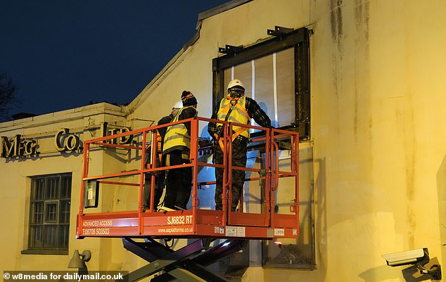 A specialist team of builders have been  brought in to remove the Banksy Goat from the side of the building on Kew Bridge