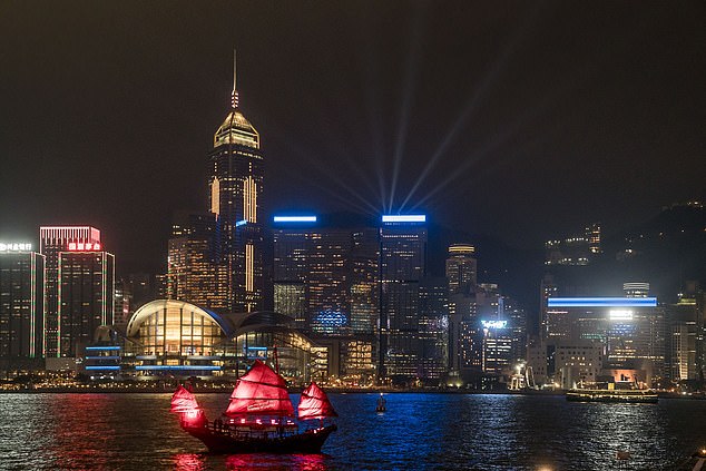 Glide across Victoria Harbour while watching the city's nightly multimedia show