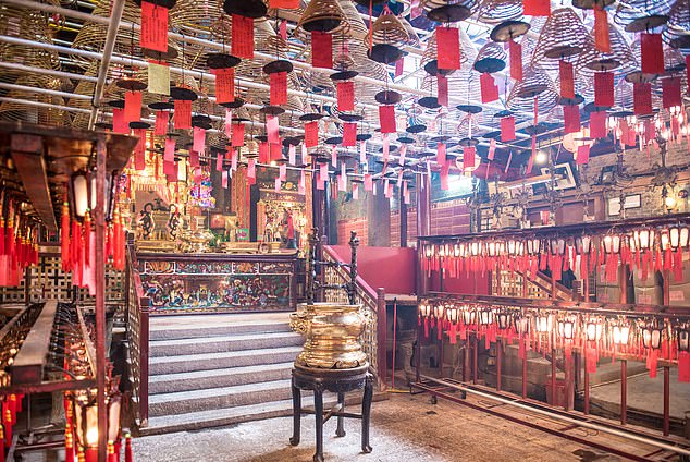 Man Mo Temple, where incense spirals create ethereal scenes