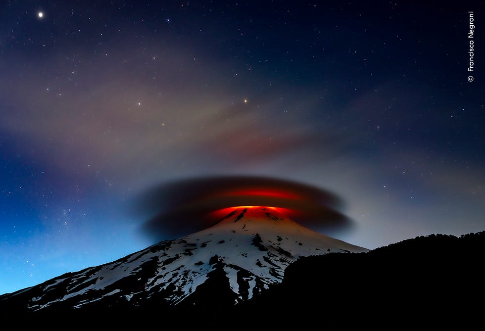 lenticular clouds and volcanic activity at night