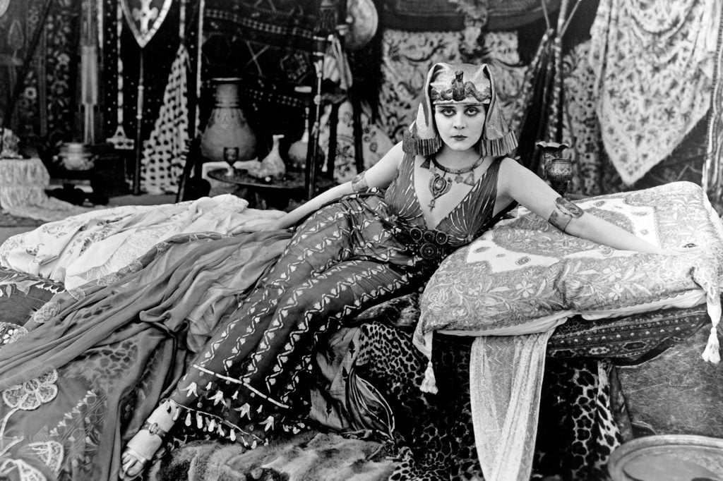 A woman in black and white dressed as Cleopatra