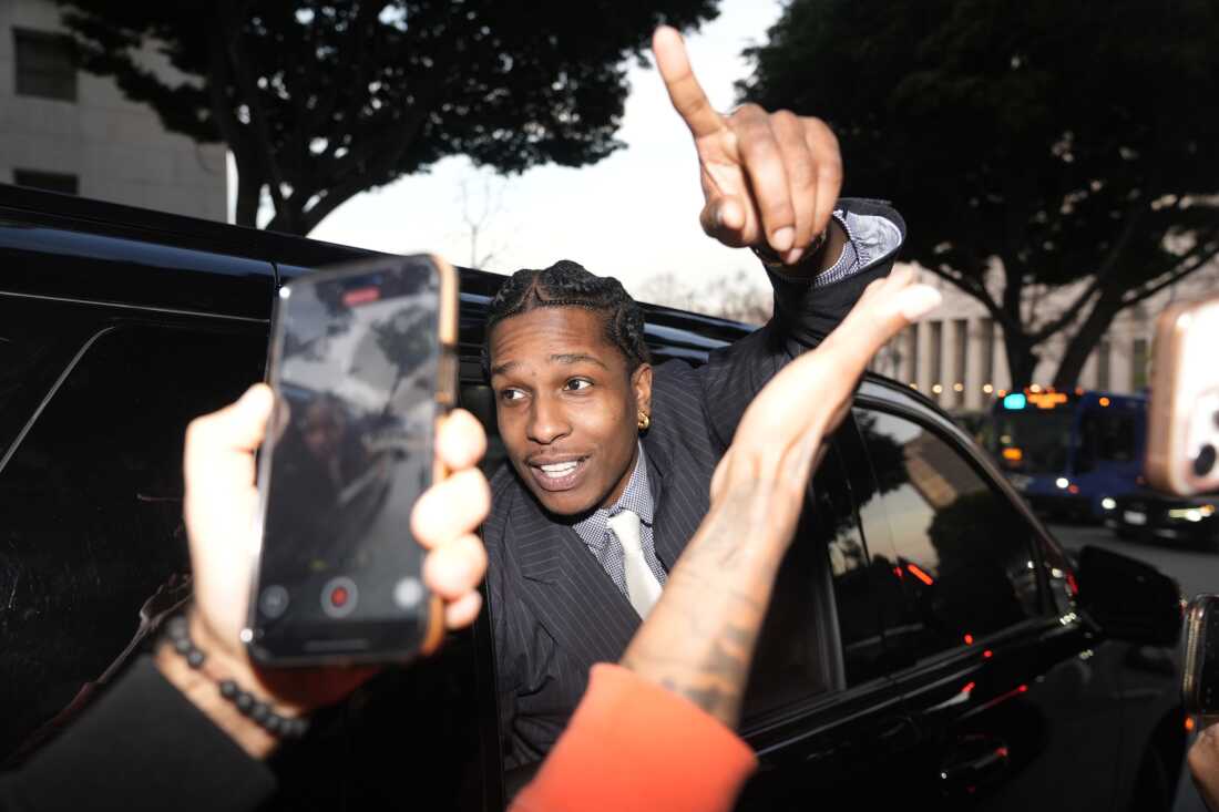 A$AP Rocky gestures out of the window of a vehicle while leaving court after he was found not guilty in his trial Tuesday in Los Angeles.