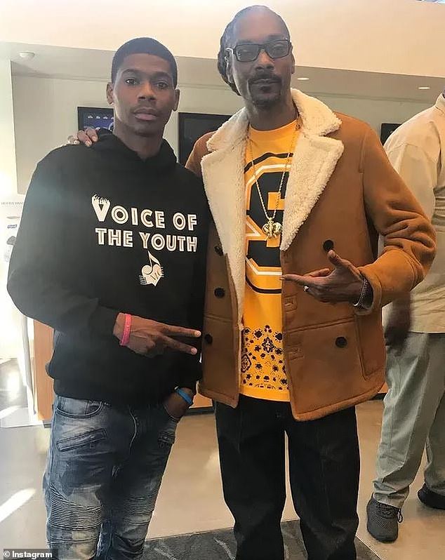 Johnson (pictured with Snoop Dogg) was known for speaking on the challenges about being a young black man in Philadelphia