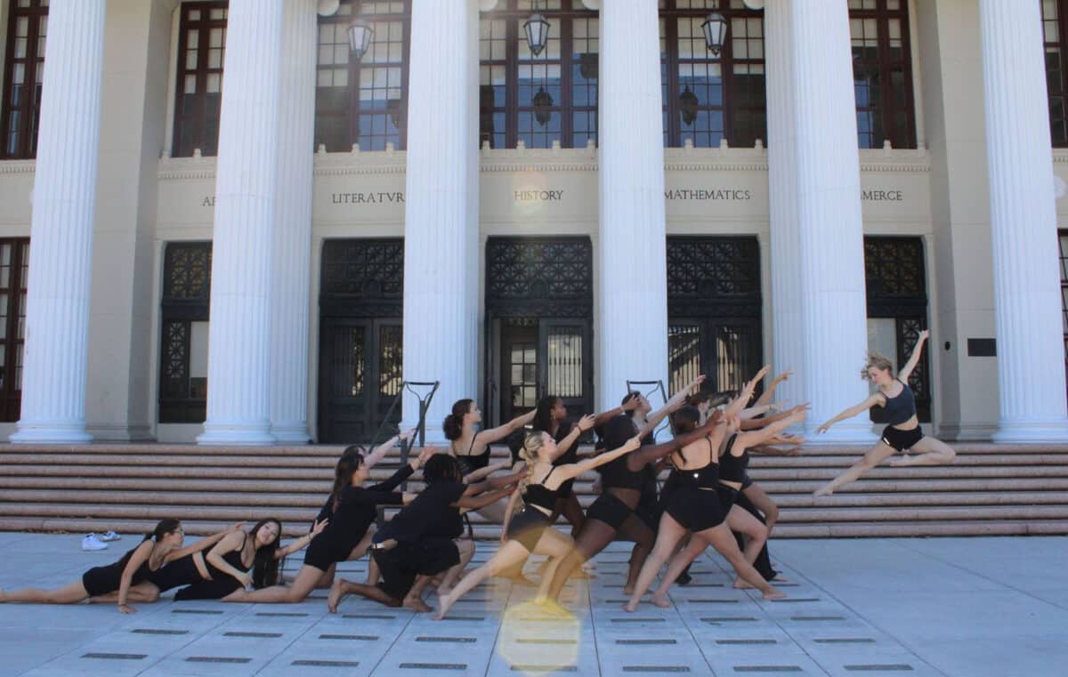 Alameda Post - Alameda High School dancers pose in front of the columns of the Alameda High School building in a dynamic photo by Rachel McCray Denton