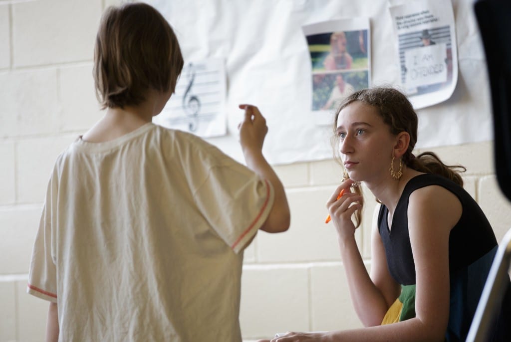 Students Layla Reese and Matti Richards Barnhill talk in a classroom.