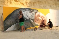 Street artists work on a mural in Los Angeles, California. Photo courtesy of Stevehymon/Dreamstime.com.