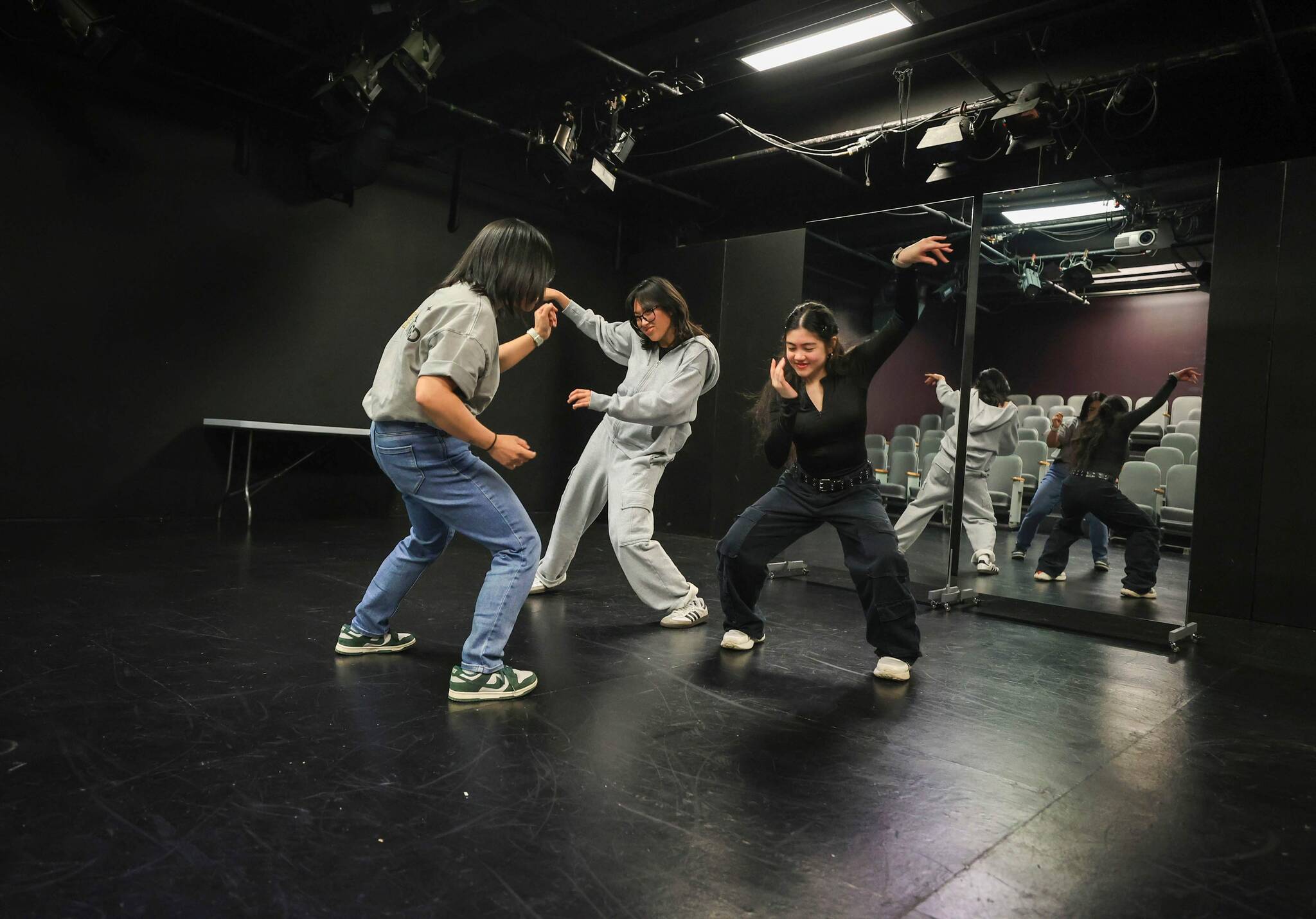 Ruth Bonneville / Free Press From left: Choreographer Sharlyne Chua leads dancers Ephifany Tiongco and Gwyneth De Guzman through their steps during rehearsal for The Remix, a hip hop dance show featuring 70 dancers and multiple choreographers.