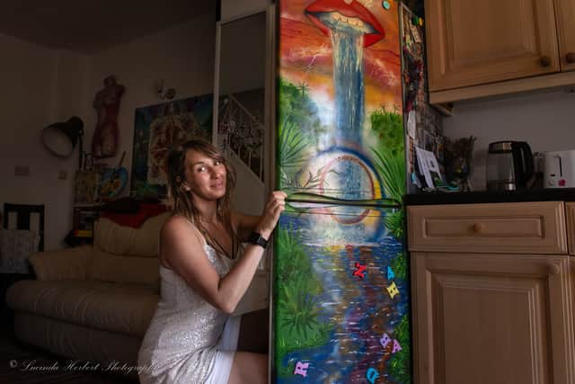 Omani Hamer with her fridge mural. Photo credit: Lucinda Herbert